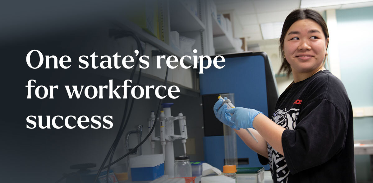 In white, text says One state's recipe for workforce success. There is a student on the right looking to her left shoulder as she works at a laboratory. 